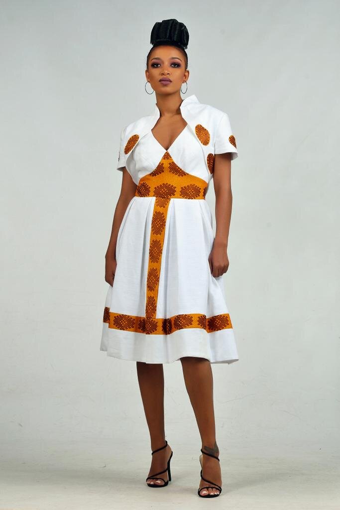 Midi dress and traditional fabric panels with cropped jacket